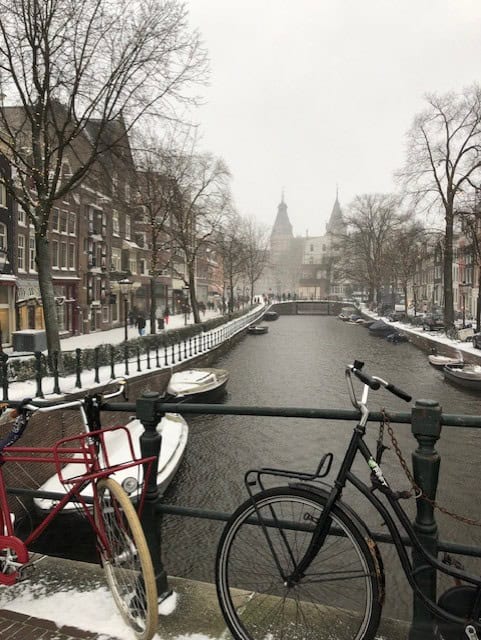 two bikes in front of a river