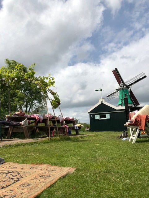 table and a windmill in a field