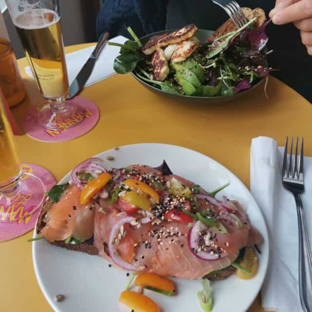 Food in plates on a yellow table