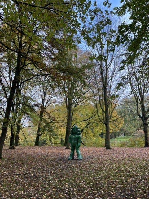 Statue in a park with trees