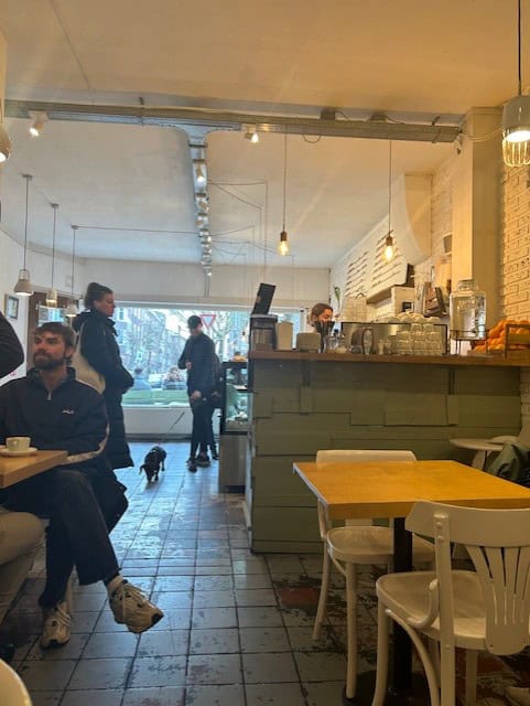 People in a cafe sitting at a table