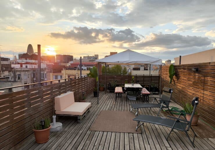 Sun setting on a rooftop overlooking the city of Barcelona 